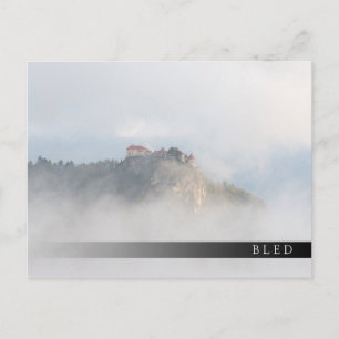 Bled castle surrounded by clouds postcard