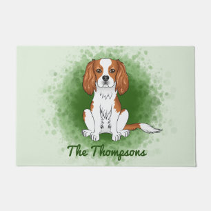 Blenheim Cavalier King Charles Spaniel On Green Doormat