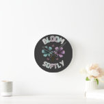 Bloom Softly Spring Floral Design Pastel Cottageco Round Clock<br><div class="desc">A beautiful spring-inspired floral design featuring the phrase “Bloom Softly” with pastel flowers and butterflies. This artwork reflects the freshness of spring,  blooming nature,  and soft aesthetic vibes.

Perfect for gifts,  apparel,  and accessories during the spring season.</div>