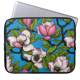 Blooming magnolia on blue laptop sleeve
