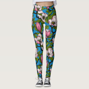 Blooming magnolia on blue leggings