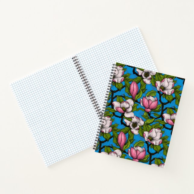 Blooming magnolia on blue notebook (Inside)