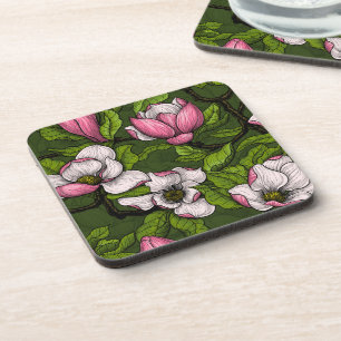 Blooming magnolia on dark green coaster