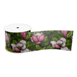 Blooming magnolia on dark green satin ribbon