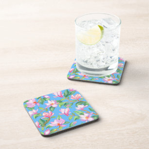 Blooming magnolia on sky blue coaster