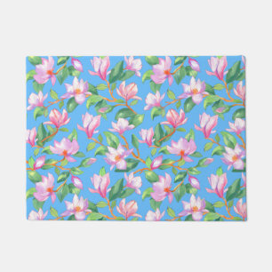 Blooming magnolia on sky doormat