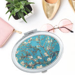 Blossoming Almond Tree by Vincent van Gogh Vanity Mirror<br><div class="desc">A compact mirror with Vincent van Gogh's,  Blossoming Almond Tree (1890),  an oil painting from the Post-Impressionist period,  showcasing white and pink spring blossoms on tree branches with a vivid blue sky.</div>