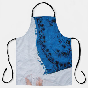 Blue and black floral scarf on white sand apron