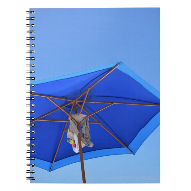 Blue and brown patio umbrella in the morning notebook (Front)