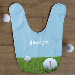 Blue and Green First Birthday Funny Golf Cute Boy Bib<br><div class="desc">Suitable for all future golfing champions and dads that dribble. Golf balls on the green,  with a number that can be seen. Catching those dribbles is the aim,  add your little golfer's name.</div>