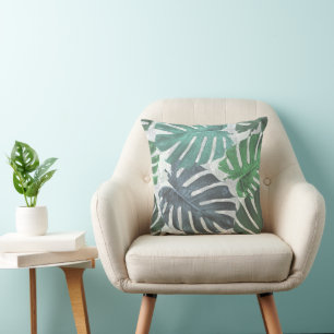 Blue and green palm tropical leaves cushion