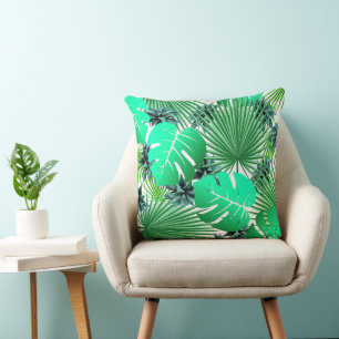 Blue and green palm tropical leaves cushion