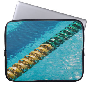 Blue and white beaded necklace on blue body of wat laptop sleeve