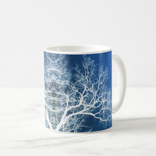 Blue and white silhouetted trees coffee mug