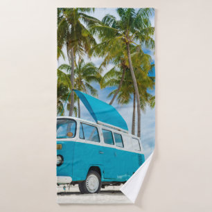 Blue and white van on beach bath towel