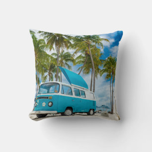 Blue and white van on beach cushion
