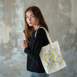 Blue and yellow lemon vines tote bag<br><div class="desc">Infuse your everyday look with Mediterranean flair using this Blue and Yellow Lemon Vines Tote Bag. Featuring lively blue branches and cheerful yellow lemons, the design captures the essence of a blossoming citrus orchard perfect for market trips, beach days, or casual outings. Inspired by classic Greek and Italian style, the...</div>