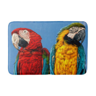 Blue and yellow macaw and a Scarlet macaw Bath Mat