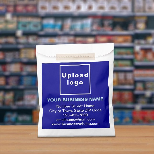 Blue Business Brand on Paper Bag (Paper bag with blue business branding displayed in a store)