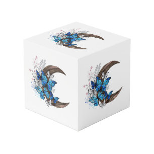 Blue butterflies on wooden crescent cube