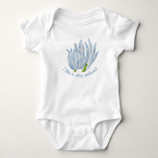 Blue Chalk Sticks on a Baby Bodysuit