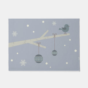 Blue christmas bird on tree doormat