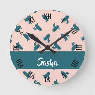 Blue coiled snakes on pink round clock