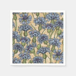 Blue cornflowers, wild flowers on honney yellow napkin