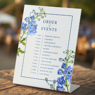 Blue delphinium botanical wedding order of event pedestal sign