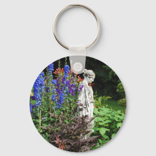 Blue delphinium flower garden and statue key ring