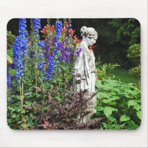 Blue delphinium flower garden and statue mouse pad