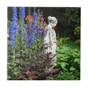 Blue delphinium flower garden and statue tile