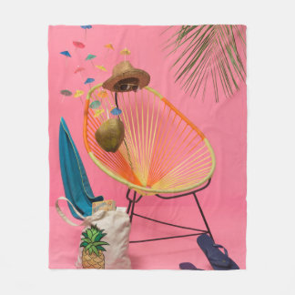 Blue flip-flop beside chair fleece blanket