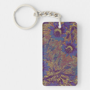 Blue flowers against leaf camouflage pattern key ring