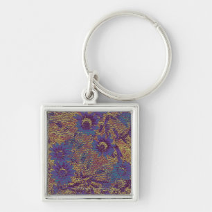 Blue flowers against leaf camouflage pattern key ring