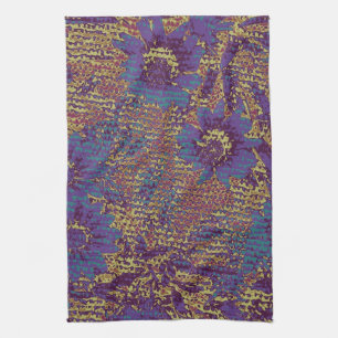 Blue flowers against leaf camouflage pattern tea towel