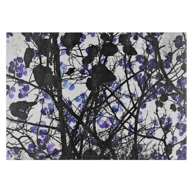Blue flowers on winter tree concept digital art cutting board (Front)