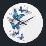 Blue Flying Butterflies Morpho Large Clock<br><div class="desc">Flying Blue Butterflies morpho and white butterflies on a light abstract background. Morpho. Design with blue butterflies morpho.</div>