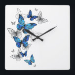 Blue Flying Butterflies Morpho Square Wall Clock<br><div class="desc">Flying Blue Butterflies morpho and white butterflies on a light abstract background. Morpho. Design with blue butterflies morpho.</div>