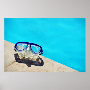 Blue framed swimming goggles near pool at daytime poster