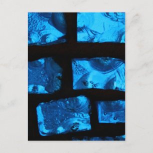 Blue glass chunks with black grout between them postcard