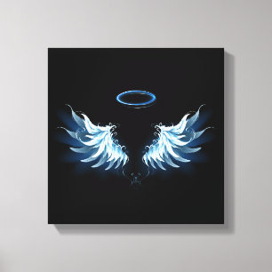 Blue Glowing Angel Wings on black background Canvas Print