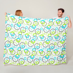 blue green and black rings and circles on white  fleece blanket