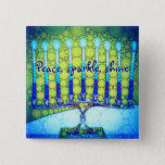 Blue Green Hanukkah Menorah Peace Sparkle Shine 15 Cm Square Badge<br><div class="desc">“Peace, sparkle, shine.” A close-up photo of a bright, colorful, blue and green artsy menorah helps you usher in the holiday of Hanukkah in style. Feel the warmth and joy of the holiday season whenever you wear this chic, colorful Hanukkah button. Matching cards, postage, stickers, pillows, housewares, totebags, and other...</div>