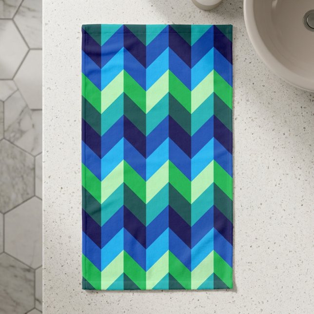 Blue Green Ombre Chevrons Hand Towel (Top down view of Blue Green Ombre Chevrons Hand Towel on a counter in a modern style bathroom.)