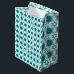 Blue Green Star of David Pattern Medium Gift Bag<br><div class="desc">This festive gift bag is designed for Jewish holidays and celebrations, featuring a Star of David pattern in vibrant blue and green tones. The stars are arranged on a crisp white background, adding a fresh, colourful touch perfect for Hanukkah, Bar or Bat Mitzvahs, and other special occasions. This gift bag...</div>