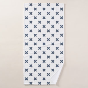 Blue-grey cross stitches on white bath towel