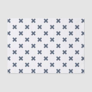 Blue-grey cross stitches on white tissue paper