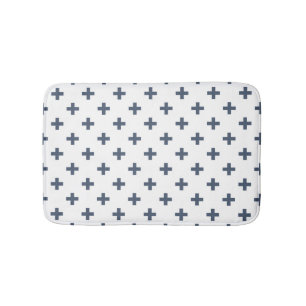 Blue-grey polka crosses on white bath mat