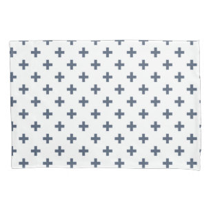 Blue-grey polka crosses on white pillowcase